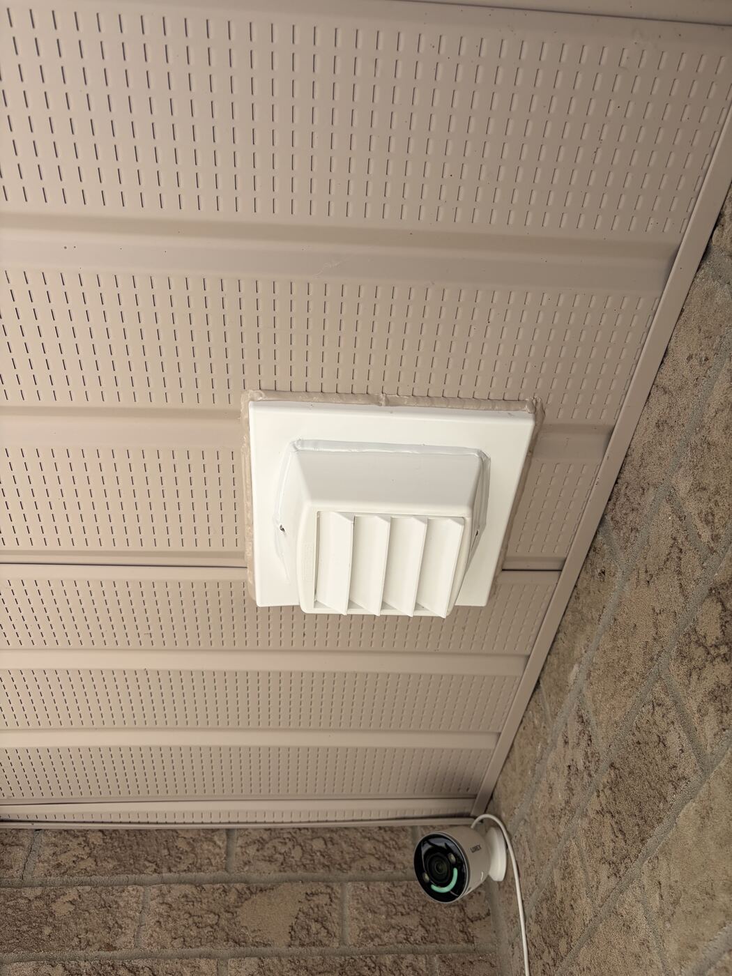 New white Thermo-Trap louvered vent sealed flush into the porch soffit